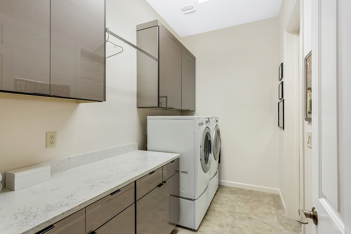 Gray gloss laundry room cabinets