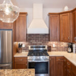 White and Warm stained kitchen cabinets