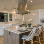 Dark stained island and white kitchen cabinets