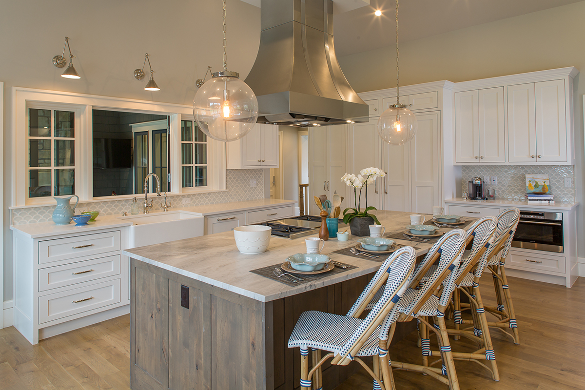 Dark stained island and white kitchen cabinets
