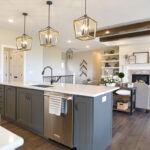 Gray kitchen island and white living room cabinets