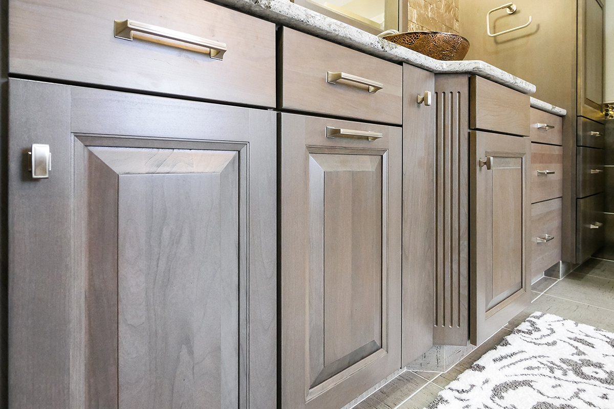 Dark stained bathroom cabinets