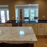 warm stained and white kitchen cabinets