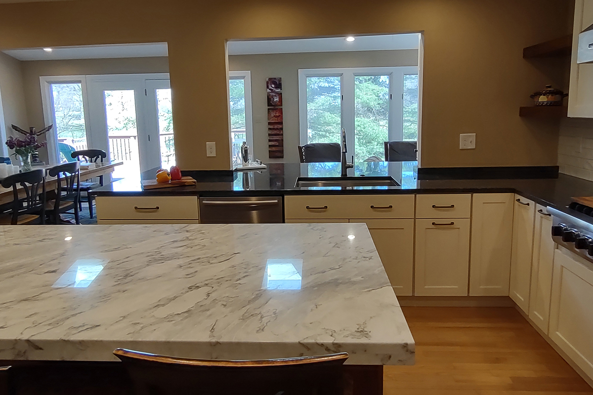 warm stained and white kitchen cabinets