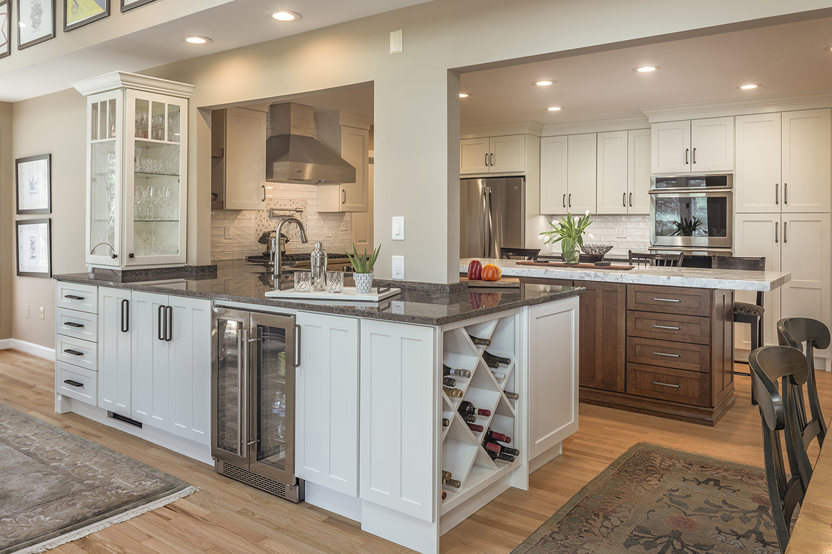 warm stained island and white kitchen cabinets