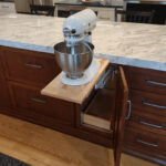 Warm stained and white kitchen cabinets