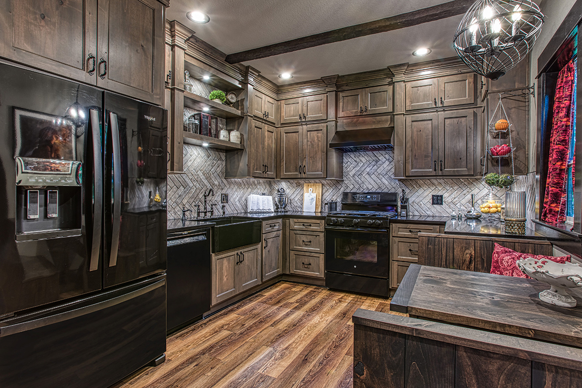 Washed cabinets with weathered backsplash in smaller kitchen.