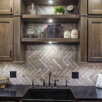 another view of the open shelving that shows the built in lights to the shelving above the sink