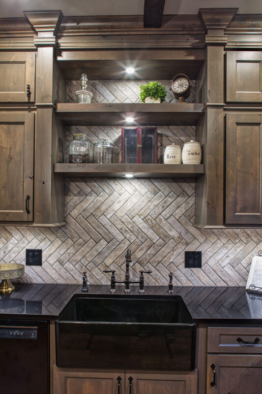 another view of the open shelving that shows the built in lights to the shelving above the sink