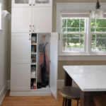Built in pantry at the edge of the kitchen.