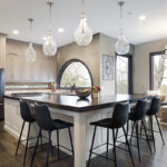 dual tone kitchen with white and cream cabinets. Shows a wide angle view.