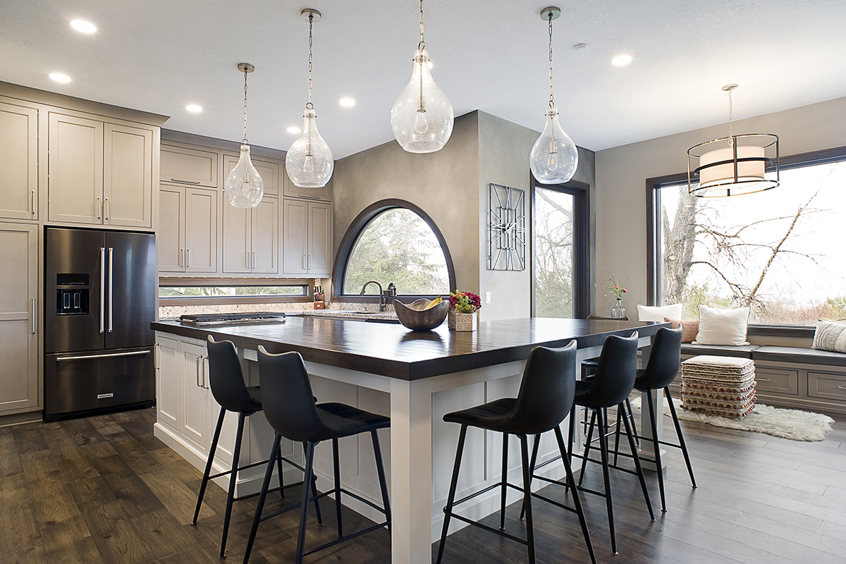 dual tone kitchen with white and cream cabinets. Shows a wide angle view.