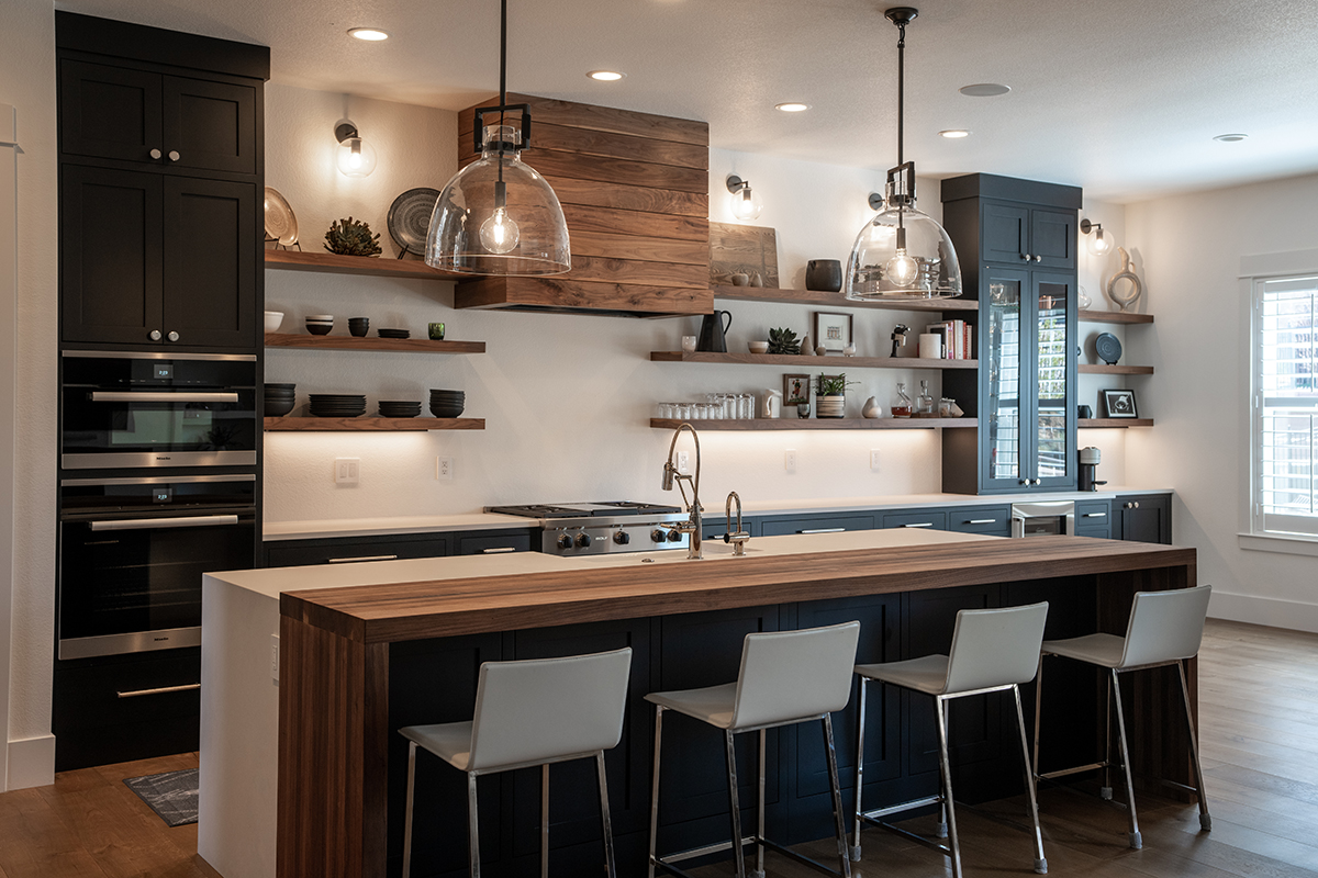Highlights the length of the kitchen with the walnut shelving