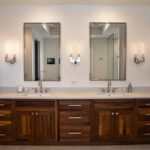 walnut cabinets under the bathroom double vanity