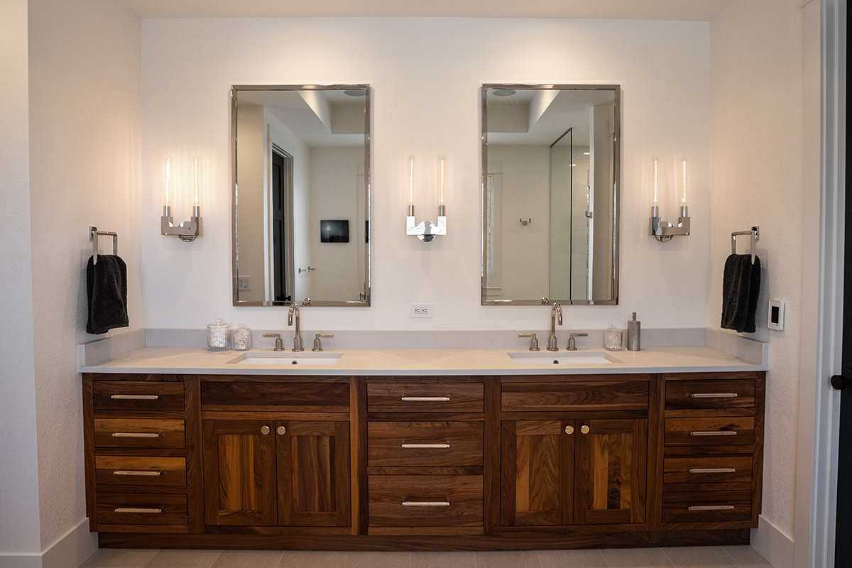 walnut cabinets under the bathroom double vanity