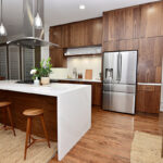 Walnut cabinets with another view of the kitchen.