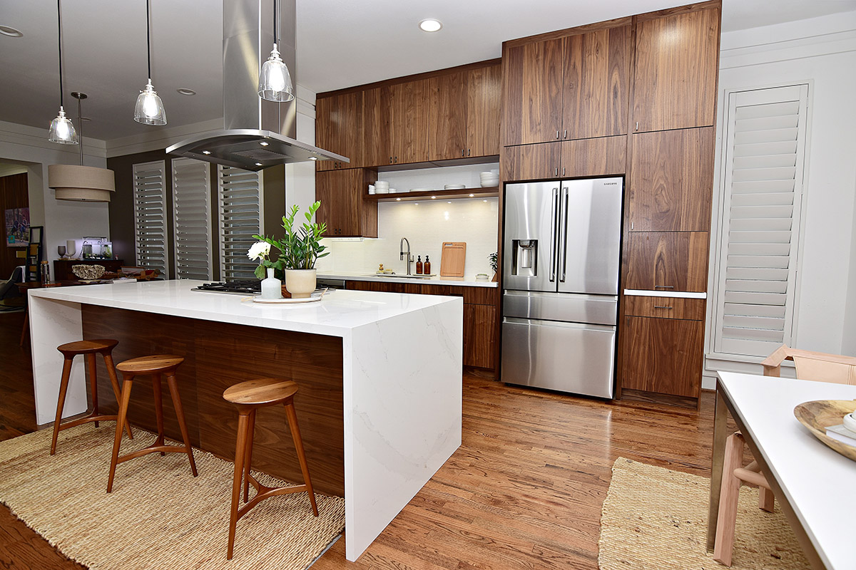 Walnut cabinets with another view of the kitchen.