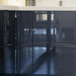A close up of the lower cabinets that shows how glossy the cabinets are.