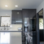 White island counter with the fridge off to the right.