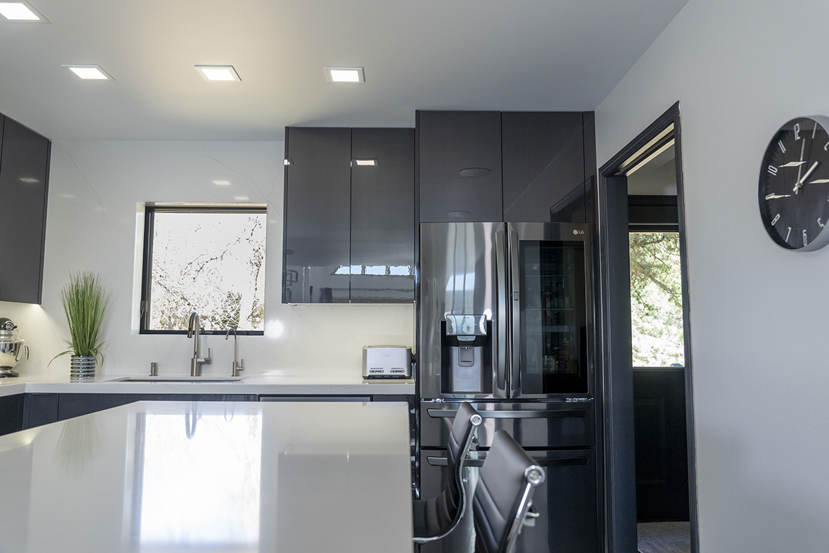 White island counter with the fridge off to the right.