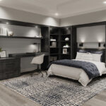 Built-in murphy bed with a built in desk and shelving around the bed.