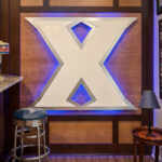 A large, lighted feature in the basement of a sports logo.