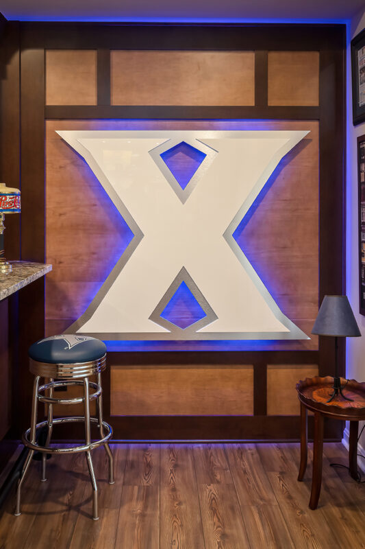 A large, lighted feature in the basement of a sports logo.