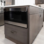large brown island with microwave installed in the side