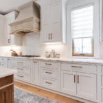 White cabinets with gold hardware.