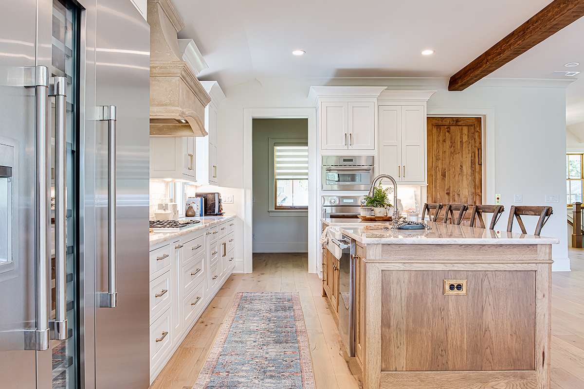 White cabinets with hickory island.