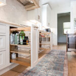 Pull-out spice racks under the stove top.