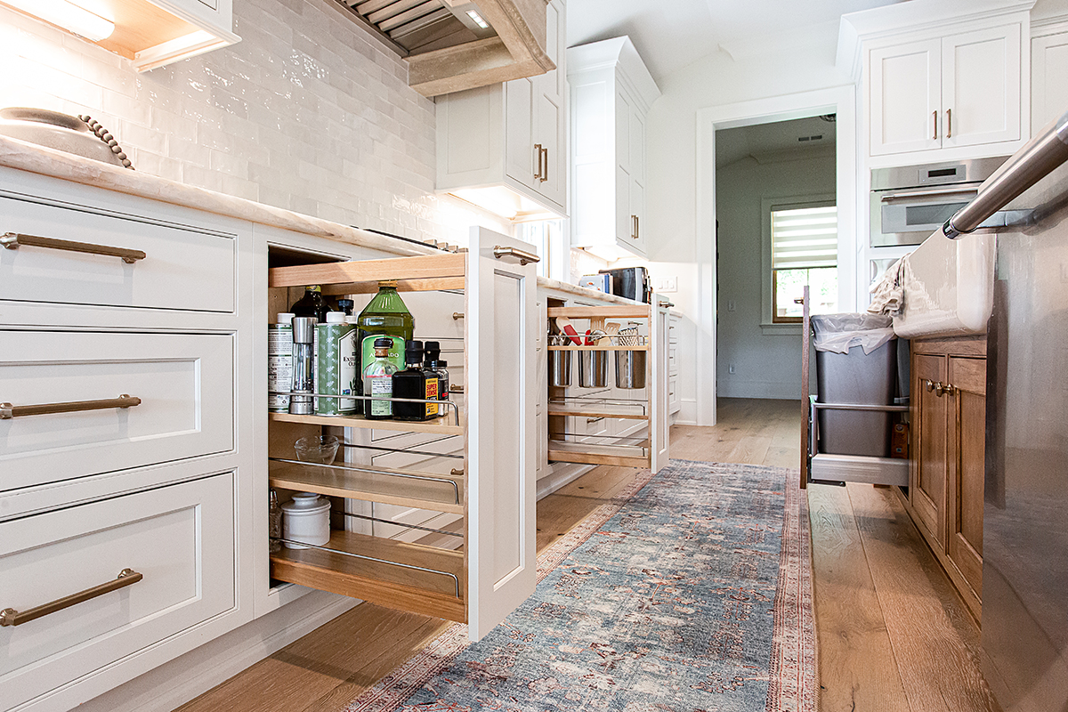 Pull-out spice racks under the stove top.