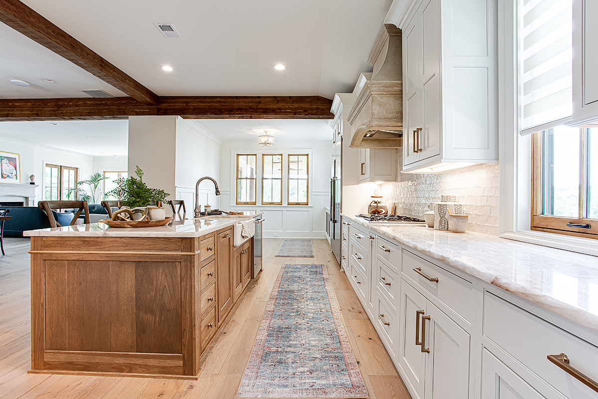 Another view of the hickory island and white cabinets.
