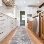 The view of the alley between the island and the exterior cabinets.