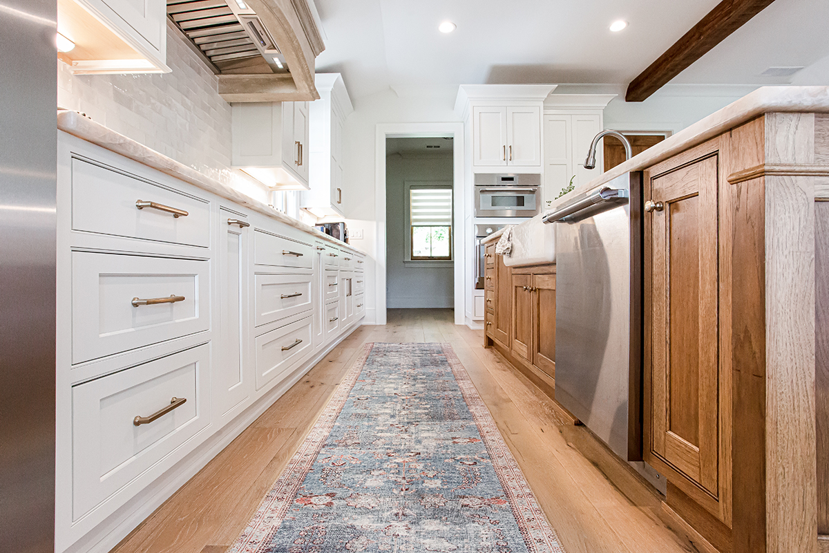 The view of the alley between the island and the exterior cabinets.