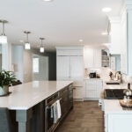 Shows a view of the alley between the exterior cabinets and the island.