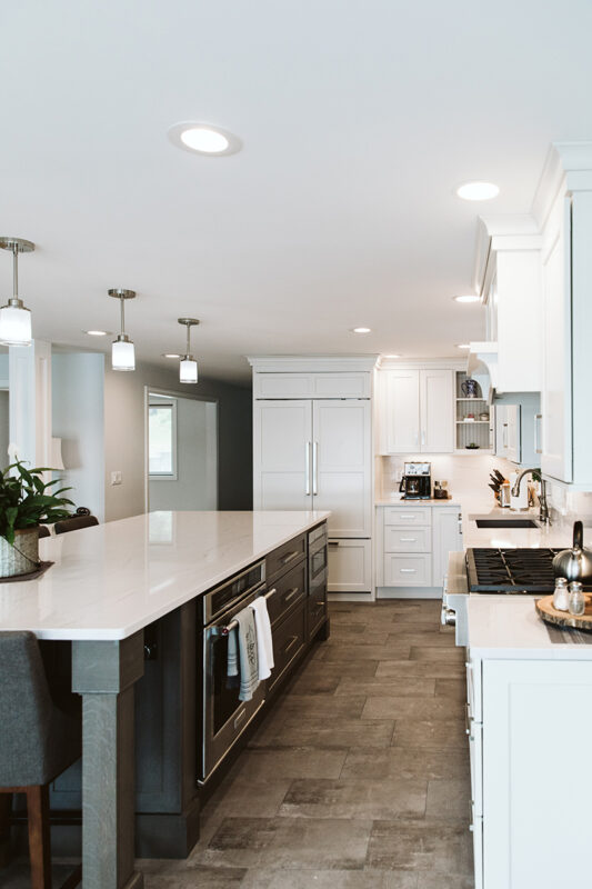 Shows a view of the alley between the exterior cabinets and the island.
