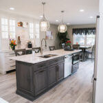 Another a view of the dark grey island and the black hardware. The island is narrow compared to other islands.