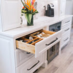 Drawer in the coffee bar that has built-in silverware separators.