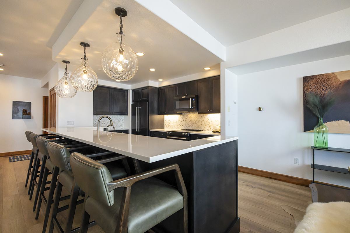 A view of the whole kitchen from the corner of the island.