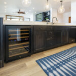 Another view of the cabinets, drawers, wine cooler, and dishwasher that make up the structure of the island.