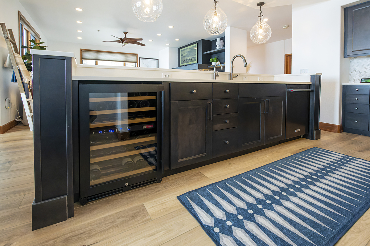 Another view of the cabinets, drawers, wine cooler, and dishwasher that make up the structure of the island.
