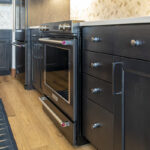 A view of the drawers that surround the oven range.