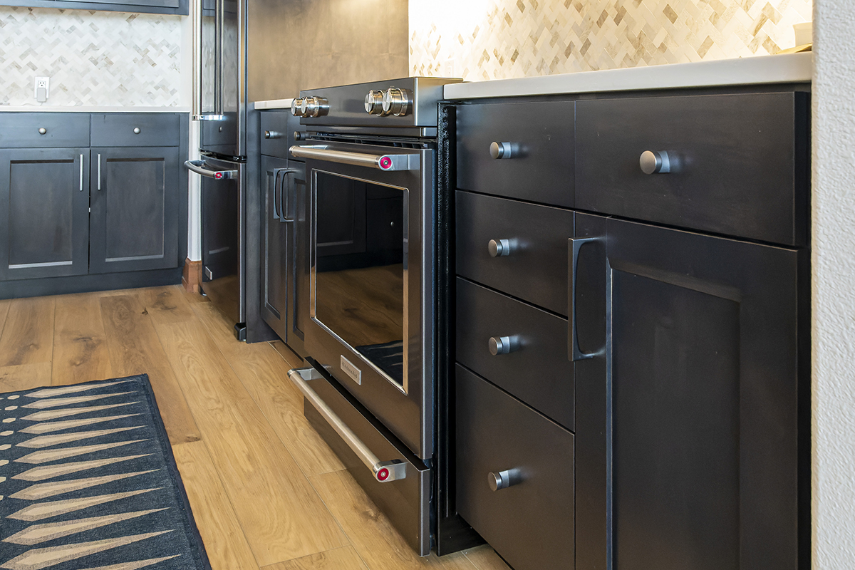 A view of the drawers that surround the oven range.