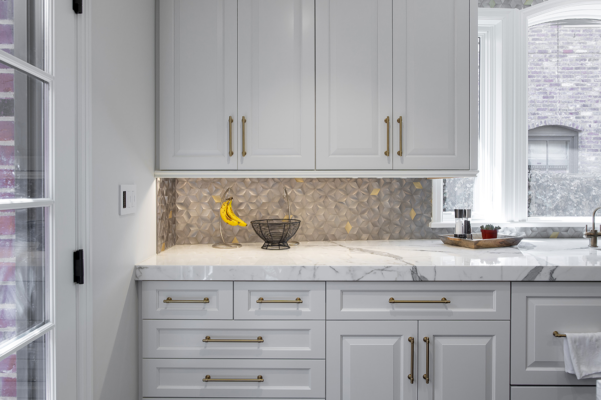 white kitchen vanity and cabinets with gold accents
