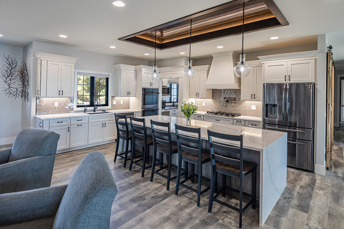 all white modern kitchen, white kitchen cabinetry and vanity, open floor plan