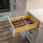 kitchen utensils drawer inside white kitchen cabinets