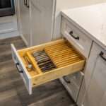knife drawer inside white kitchen cabinets