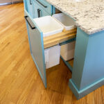 open garbage drawer inside blue island counterspace