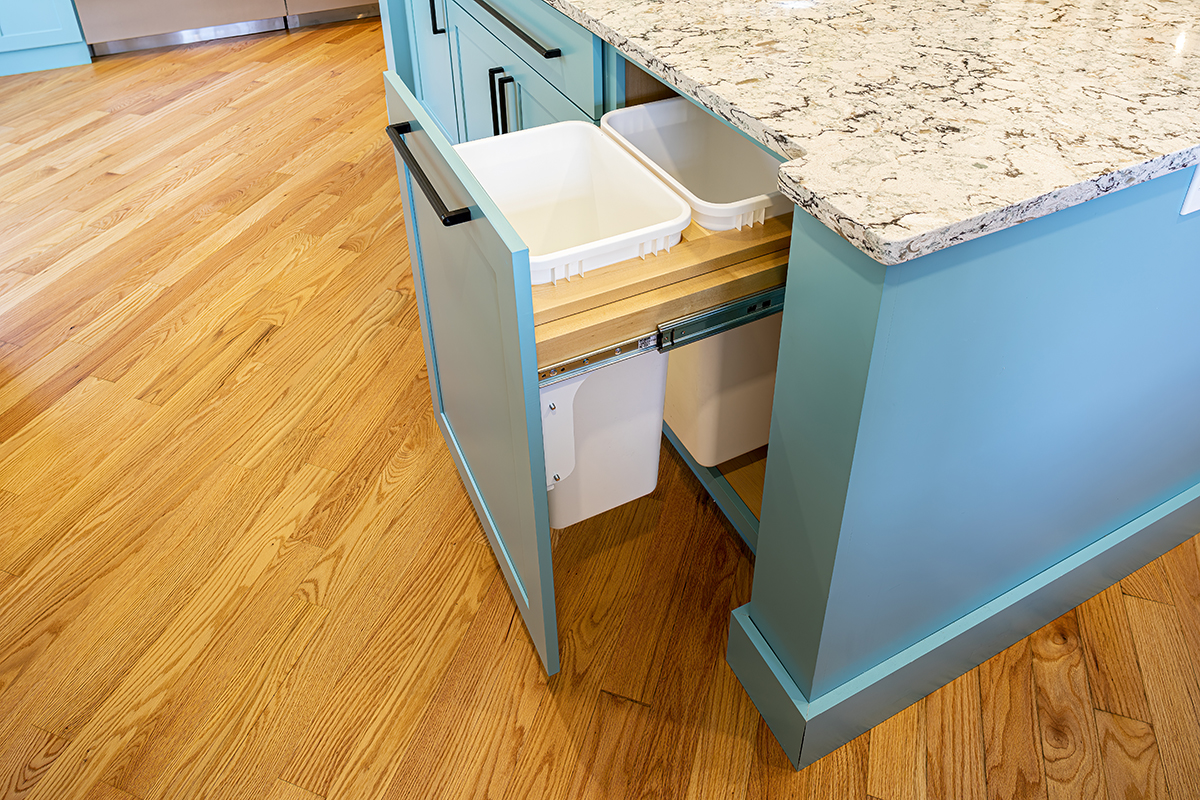 open garbage drawer inside blue island counterspace